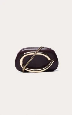 PrettyLittleThing Plum Patent PU Oval Handle Structured Hard Clutch Bag -FRAME Clothing Shop 040204502915a9febefc5b50066f95a4689e0712 CNN9779 3 plum pu oval handle hard clutch bag