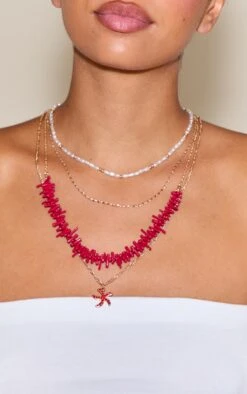 PrettyLittleThing Red and Pearl Layered Gold-Tone Chain – Starfish Pendant Statement Necklace