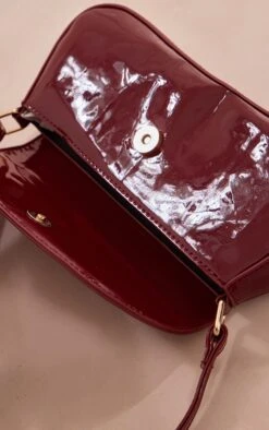 PrettyLittleThing Burgundy Patent Slim Curved Shoulder Bag - Cherry Red Flap Detail -FRAME Clothing Shop 251c61ca7ab46f22a9f8265e6b37fccf4a68712c cnh6585 4