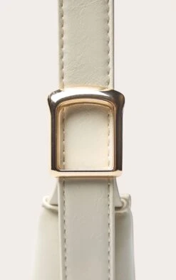 PrettyLittleThing Cream Patent PU Simple Buckle Strap Shoulder Bag -FRAME Clothing Shop 32bf18fcbad9fc3586b559a47cc4a8c6e867d1d2 CNO0734 5 cream pu simple buckle strap shoulder bag