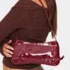 PrettyLittleThing Burgundy Patent PU Buckle Detail Baguette Shoulder Bag