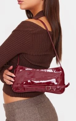 PrettyLittleThing Burgundy Patent PU Buckle Detail Baguette Shoulder Bag