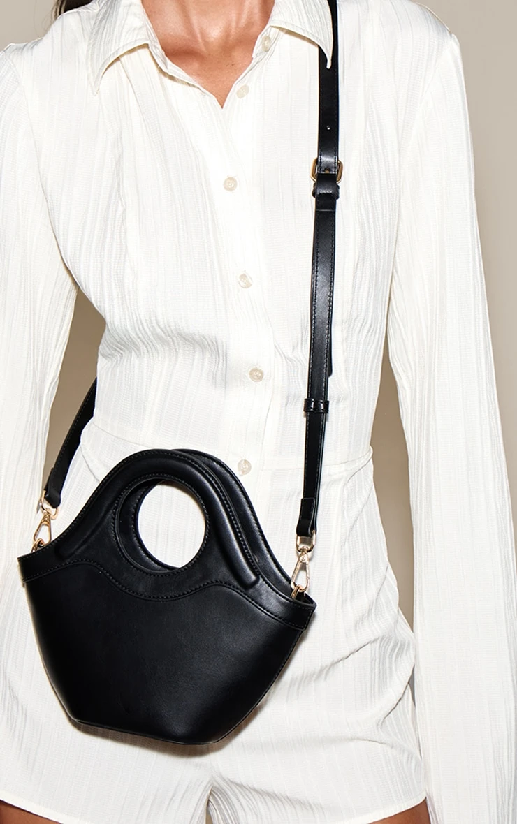 PrettyLittleThing Black Crescent Cross Body Bag – Sleek Faux Leather with Circular Handle 1 PrettyLittleThing Black Crescent Cross Body Bag – Sleek Faux Leather with Circular Handle