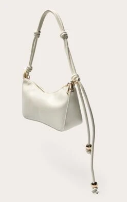 PrettyLittleThing Cream Patent PU Bead Knotted Handle Shoulder Bag -FRAME Clothing Shop 8001a5a1e39e53375201c9b6b9c3902336135670 CNO0730 3 cream bead knotted handle shoulder bag
