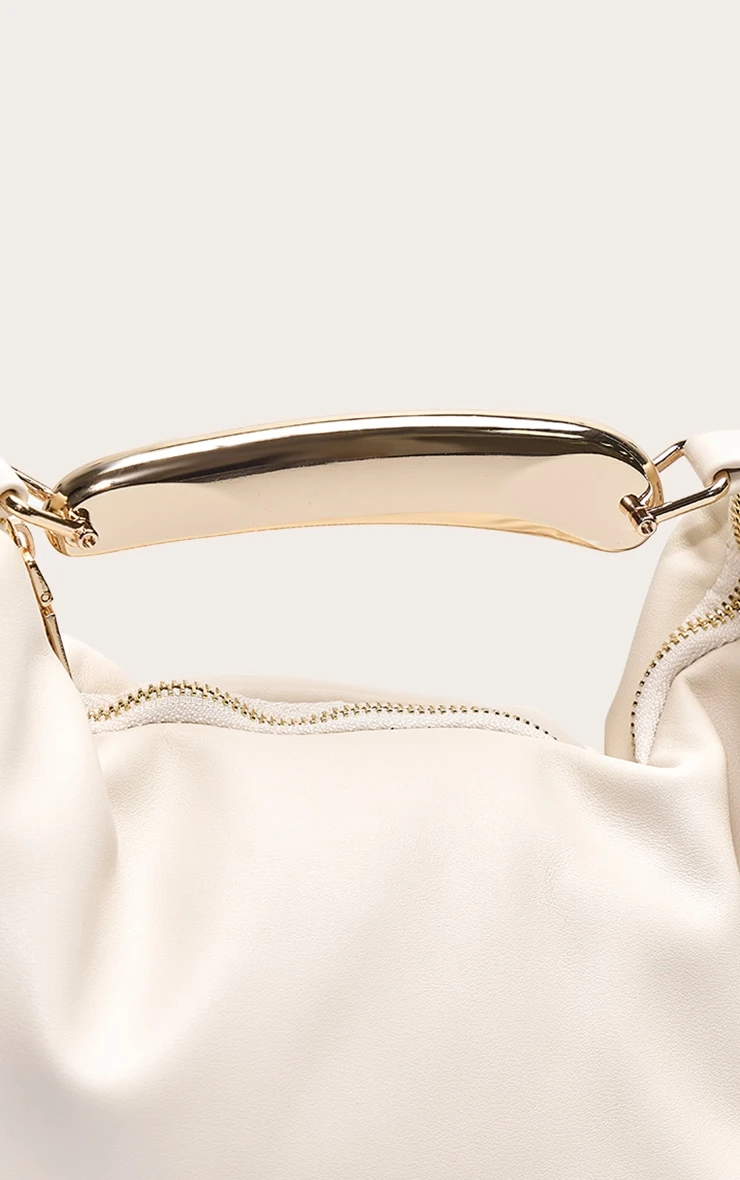 PrettyLittleThing Cream PU Gold Abstract Handle β Sculptural Mini Hand Bag 3 PrettyLittleThing Cream PU Gold Abstract Handle β Sculptural Mini Hand Bag - Image 3