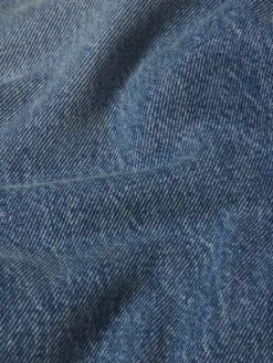 Baggy Jean -- Outfield -FRAME Clothing Shop M005DPA210 OTFL FABRICDETAIL jeans texture detail image