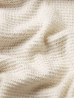 Textured Wool Cashmere Polo Sweater in Warm White β Luxury Textured Knitwear 8 Textured Wool Cashmere Polo Sweater in Warm White β Luxury Textured Knitwear -FRAME Clothing Shop MF25KSW021 WRWH FABRICDETAIL sweater texture detail image