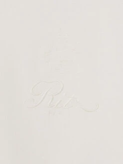 Ritz Paris Cream Tonal Logo & Crest – Luxe Cotton-Blend Crewneck Sweatshirt 17 Ritz Paris Cream Tonal Logo & Crest – Luxe Cotton-Blend Crewneck Sweatshirt -FRAME Clothing Shop MP25JSS006 CREA DET EMBLEM sweatshirt logo detail image