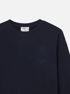 Ritz Paris Dark Navy Tonal Logo Crewneck – Exclusive Embroidered Crest Sweatshirt -FRAME Clothing Shop MP25JSS006 DKNV DET sweatshirt front detail packshot image