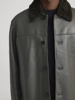 Men's Dark Olive Lamb Shearling Jacket – Boxy Silhouette with Contrast Collar 10 Men's Dark Olive Lamb Shearling Jacket – Boxy Silhouette with Contrast Collar -FRAME Clothing Shop MP26LJA001 DKOL 0513 jacket front detail image