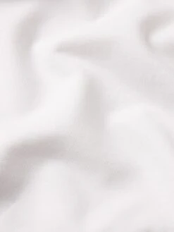 The Tennis Sweatpant -- White -FRAME Clothing Shop WF25JPA001 WHT FABRICDETAIL pants texture detail image