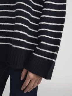 The Striped Cashmere Turtleneck -- Navy Multi 9 The Striped Cashmere Turtleneck -- Navy Multi -FRAME Clothing Shop WP26KSW071 NAMU LSLSL814 FRWY 2362 sweater side angle detail image