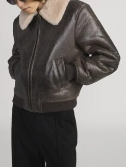 The Shrunken Shearling Bomber -- Cardamom 11 The Shrunken Shearling Bomber -- Cardamom -FRAME Clothing Shop WP26LOW002 CRDM 2642 jacket side angle image