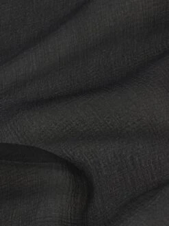 The Tiered Statement Blouse -- Black 13 The Tiered Statement Blouse -- Black -FRAME Clothing Shop WP26WBL015 BLK FABRICDETAIL 18484dda 28f6 4b45 a781 27d8764ec84b top texture detail image