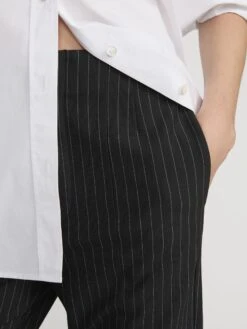 The Sleek Trouser -- Black Pinstripe 10 The Sleek Trouser -- Black Pinstripe -FRAME Clothing Shop WP26WPA024 BLPN 2357 pants front detail image
