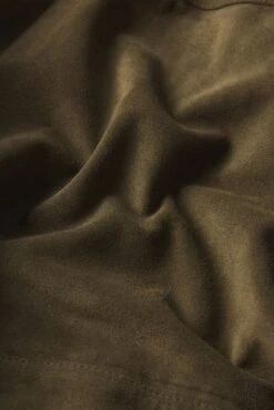 The Small Suede Jacket -- Cypress 9 The Small Suede Jacket -- Cypress -FRAME Clothing Shop WS25LJA003 CYPR FABRICDETAIL jacket texture detail image