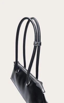 PrettyLittleThing Black Patent Elongated Handle Shoulder Bag β Structured Minimalist Handbag 8 PrettyLittleThing Black Patent Elongated Handle Shoulder Bag β Structured Minimalist Handbag -FRAME Clothing Shop cb27c4ae37c5603c5232069a0043448caf3e45ff CNO0718 4 black elongated handle shoulder bag