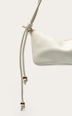 PrettyLittleThing Cream Patent PU Bead Knotted Handle Shoulder Bag -FRAME Clothing Shop e65f3072f579b4c960511568f9a9dd8f749dfd99 CNO0730 4 cream bead knotted handle shoulder bag