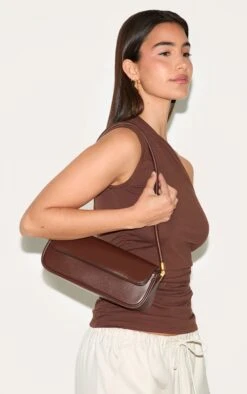 PrettyLittleThing Chocolate PU Skinny Elongated Shoulder Bag - Chic Minimalist Brown Handbag 9 PrettyLittleThing Chocolate PU Skinny Elongated Shoulder Bag - Chic Minimalist Brown Handbag -FRAME Clothing Shop ea959bc2190447d4df80c5bf6a5d9040fe235eb1 CNM3895 5 chocolate pu skinny elongated shoulder bag